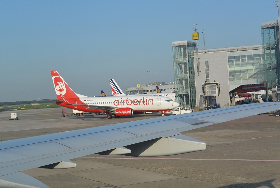 Düsseldorf Airport 12 Air Berlin aircraft stationed at Düsseldorf Airport, featuring the terminal building behind it.