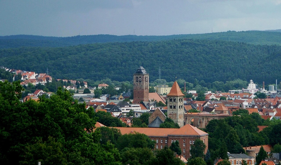 German Half-Timbered Route: Complete 7-Day Itinerary 18 Scenic image of Bad Hersfeld, Germany, showcasing a church tower with lush trees in the backdrop.