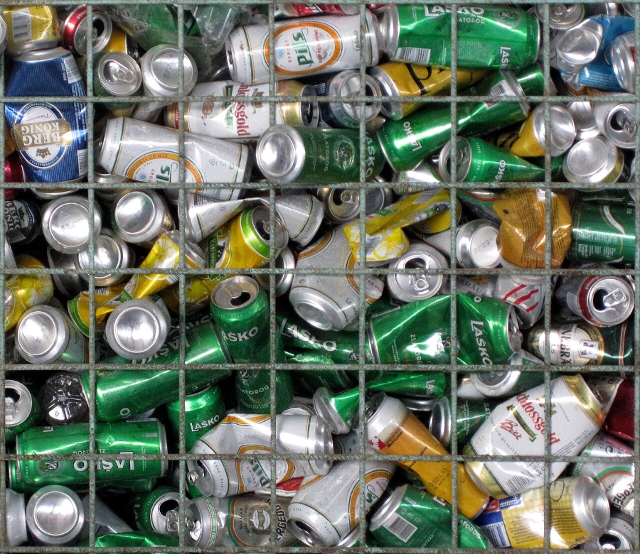 Pfand System Explained: Germany's Bottle Deposit Complete Guide 17 Wire mesh bin overflowing with different types of metal cans ready for recycling.