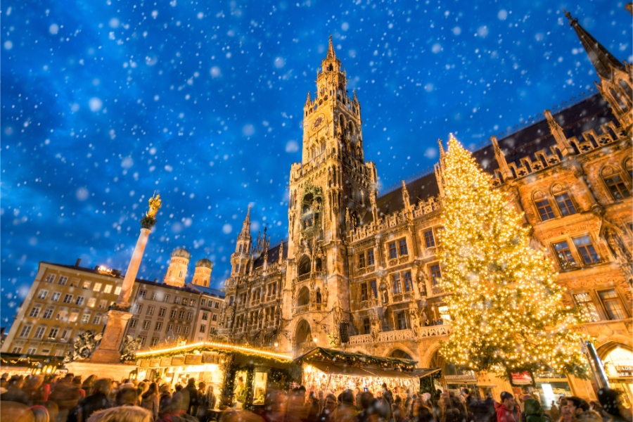 The vibrant Christmas market in Munich, Germany, showcasing colorful stalls filled with seasonal goods and cheerful visitors.