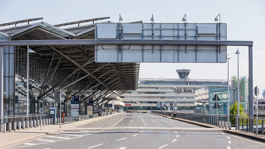 Cologne Bonn Airport 27 An empty street featuring a large metal structure, representing the Köln Bonn Airport building.