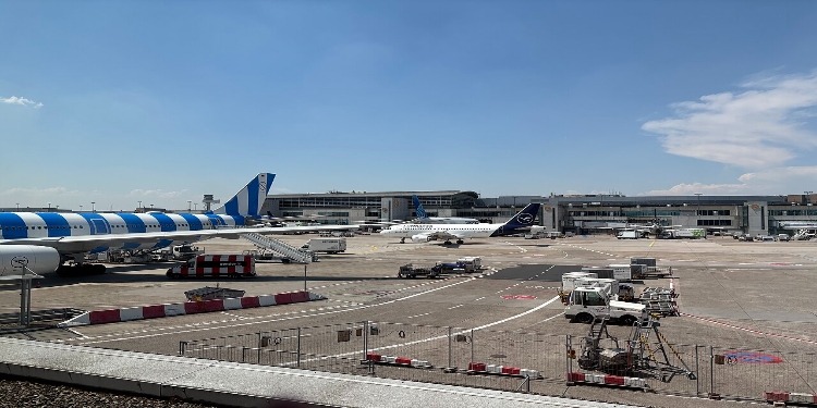 Frankfurt Airport 7 Blue and white aircraft stationed at Frankfurt Airport, highlighting its modern features and vibrant color scheme.