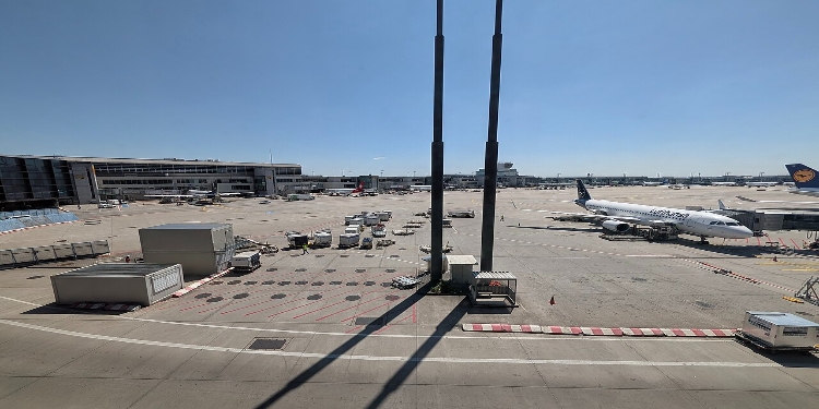 Frankfurt Airport 2 Several planes parked on the tarmac at Frankfurt Airport, showcasing a busy aviation hub.