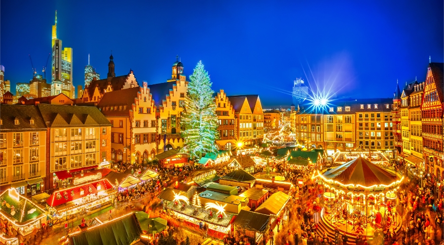 The Ultimate Guide to German Christmas Markets 9 The Frankfurt Christmas Market showcases colorful stalls adorned with lights, offering holiday goods and delicious food to visitors.