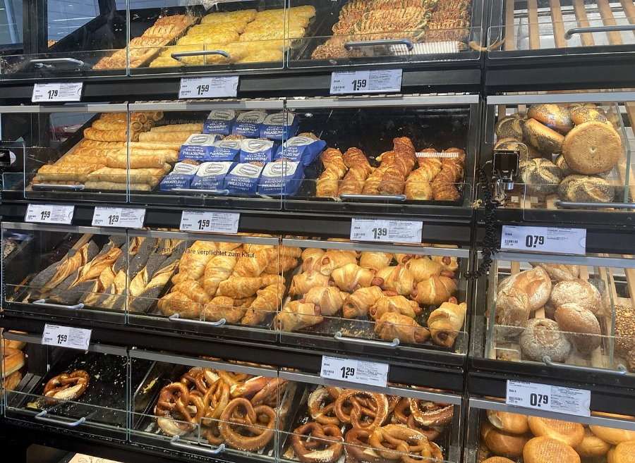 German Bread Culture: Bakeries, Loaves and Traditions 20 Bakery display case showcasing an assortment of fresh breads and pastries in Frankfurt, Germany.