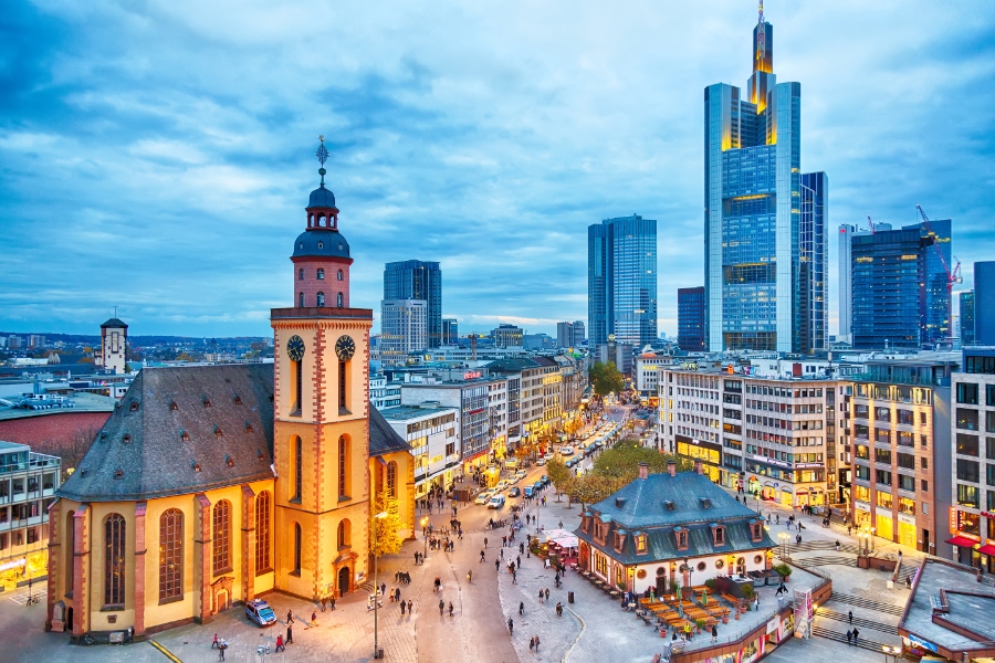 Frankfurt Airport 6 View to skyline of Frankfurt in sunset blue hour. St Paul's Church and the Hauptwache Main Guard building at Frankfurt central street Zeil.
