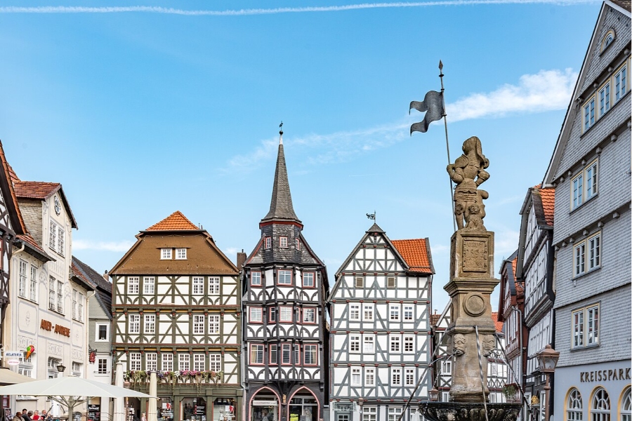 German Half-Timbered Route: Complete 7-Day Itinerary 25 People walking together on a charming street in a European city, featuring traditional architecture and vibrant storefronts.