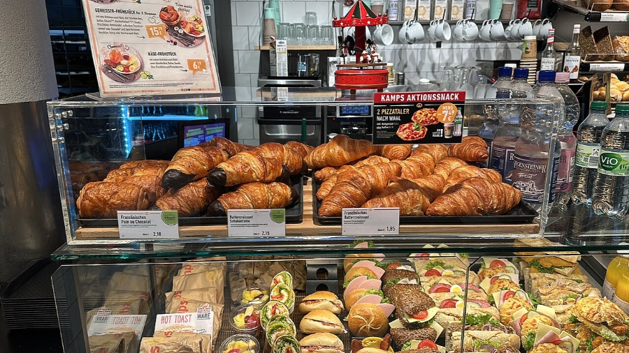 Sunday & Quiet Hours in Germany: The Complete Survival Guide 28 Variety of German breads and pastries arranged in a display case, highlighting their textures and colors.