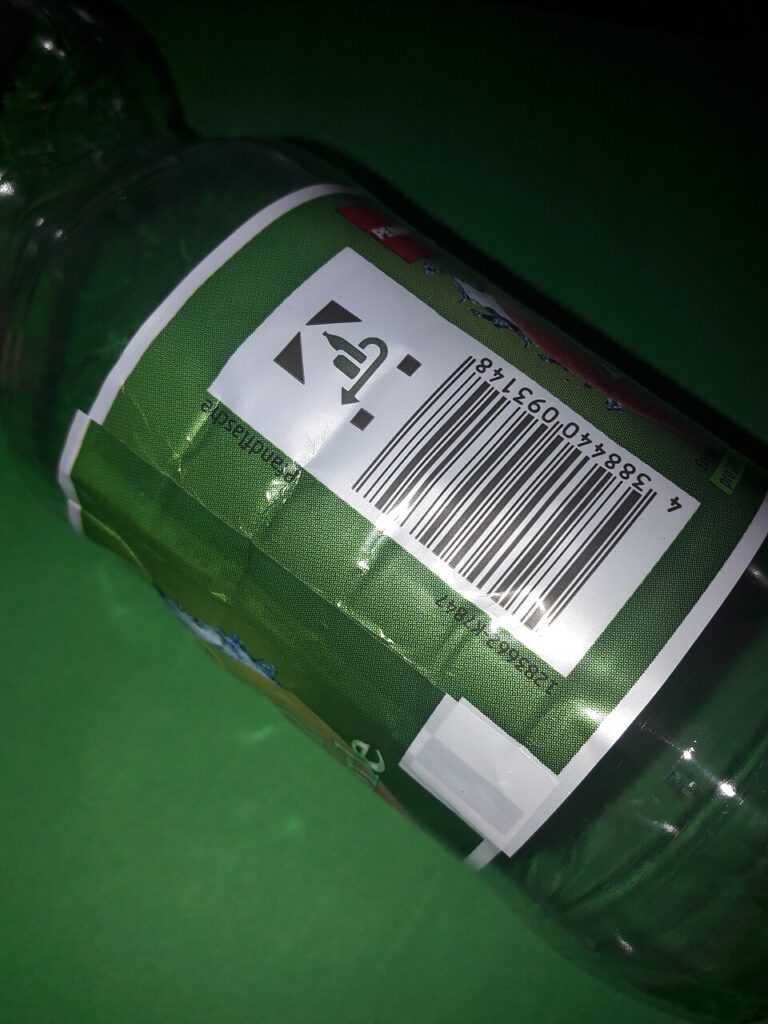Pfand System Explained: Germany's Bottle Deposit Complete Guide 9 German plastic bottle featuring a barcode label prominently displayed on its surface.
