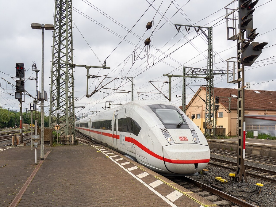German Regional Day Tickets: Decision Trees for Maximum Savings 15 Modern white and red ICE train on the tracks in Germany, representing advanced transportation technology.