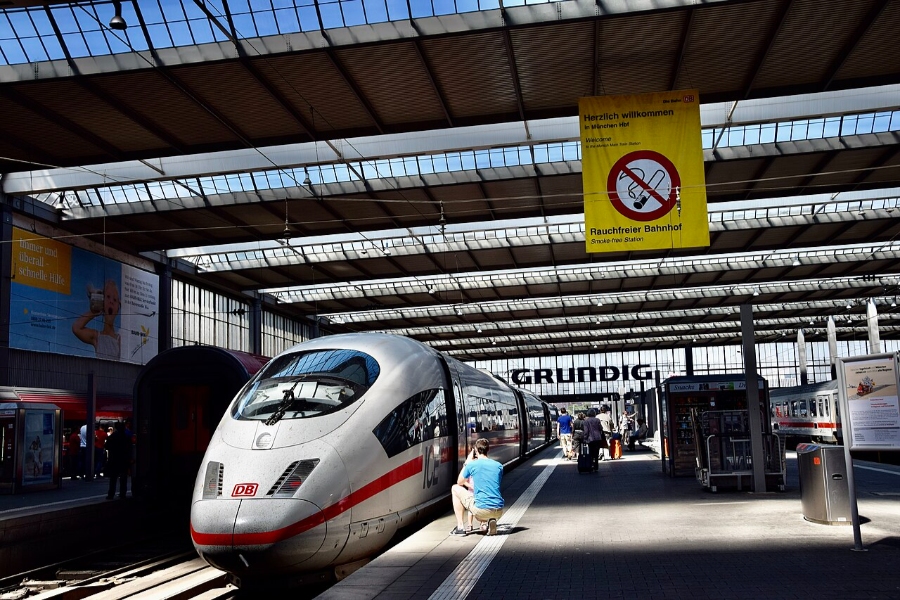 German Regional Day Tickets: Decision Trees for Maximum Savings 24 Passengers stand on the platform as a train approaches Munich Hauptbahnhof station.