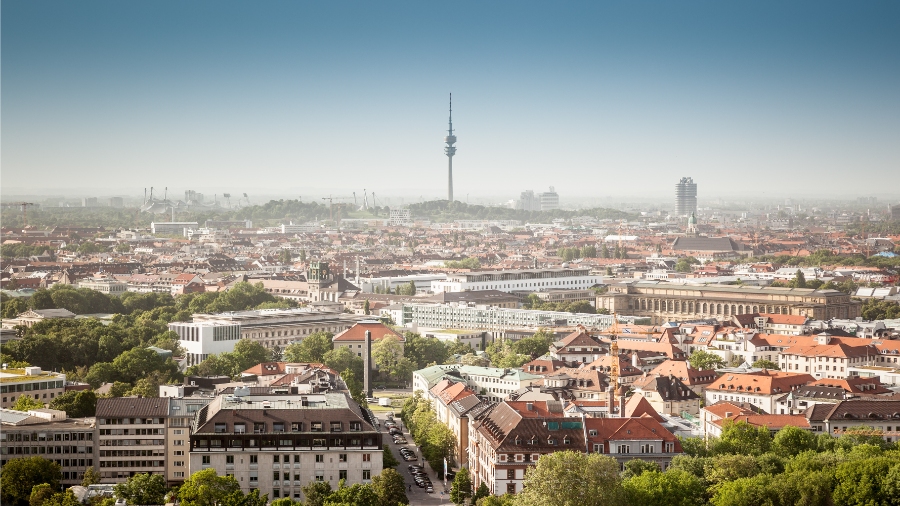 Planning a Trip to Germany: Step-by-Step Guide for First-Timers 13 Panoramic view of Munich's skyline featuring the TV tower and city center buildings against a clear blue sky.