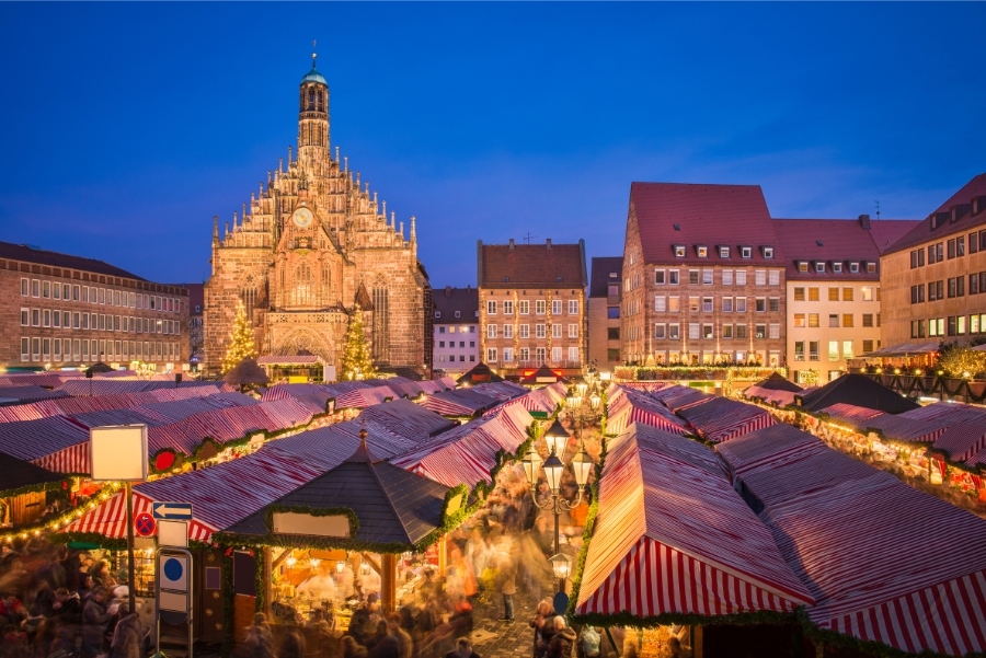 The Ultimate Guide to German Christmas Markets 2 The Nuremberg Christmas Market in Bavaria, Germany, showcasing vibrant stalls filled with seasonal goods and lights.