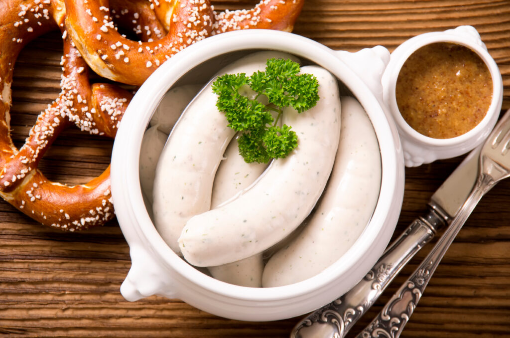 Visiting Germany for the First Time: 20 Essential Tips for New Travelers 19 Close-up of a traditional Weißwurst, a Bavarian sausage, showcasing its pale color and smooth texture.