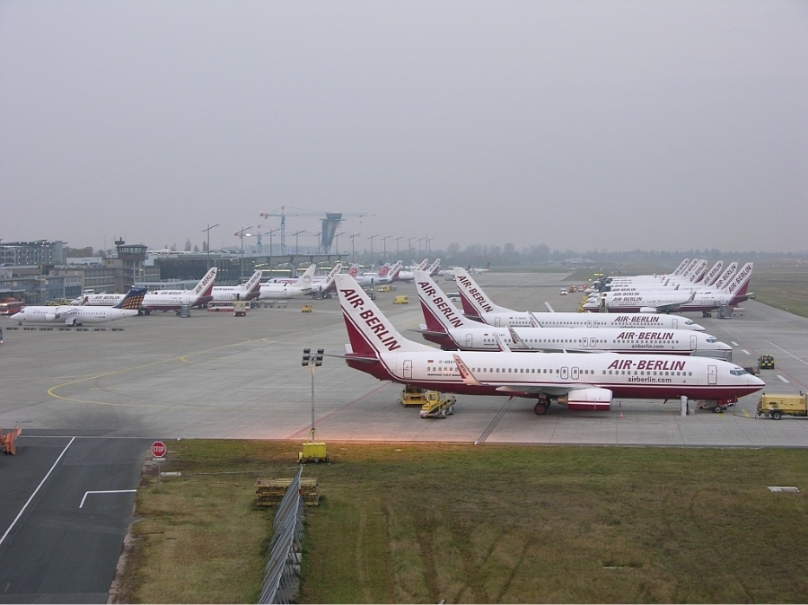 Nuremberg Airport 3 Aerial view of Nuremberg Airport showcasing multiple Air Berlin airplanes parked on the runway.