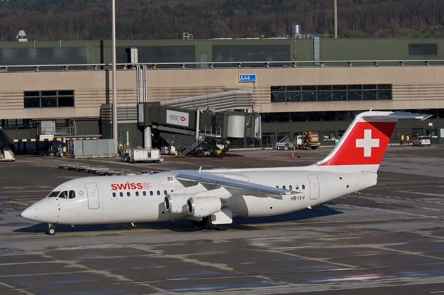 Nuremberg Airport 22 Swiss Air plane parked on the tarmac at Nürnberg Airport, Germany, with terminal buildings in the background.