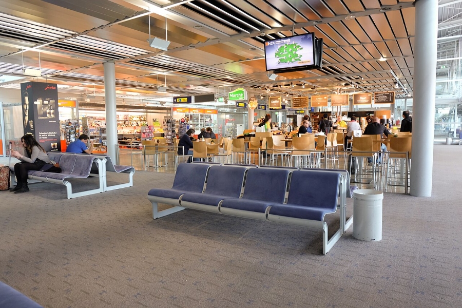 Nuremberg Airport 17 Interior view of Nürnberg Airport showing travelers seated in a large waiting area.
